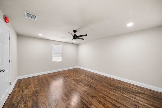 unfurnished room featuring ceiling fan and dark hardwood / wood-style flooring