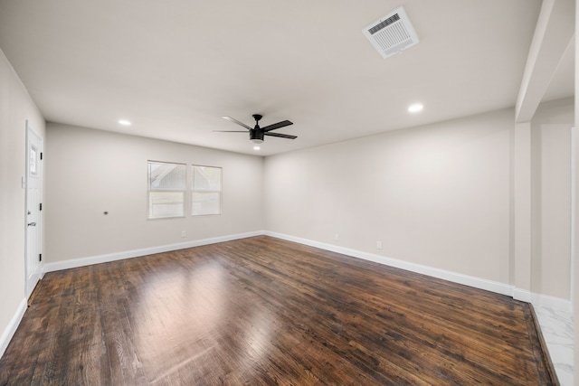 empty room with ceiling fan and dark hardwood / wood-style floors