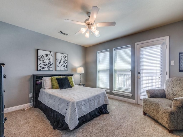 carpeted bedroom featuring ceiling fan and access to exterior