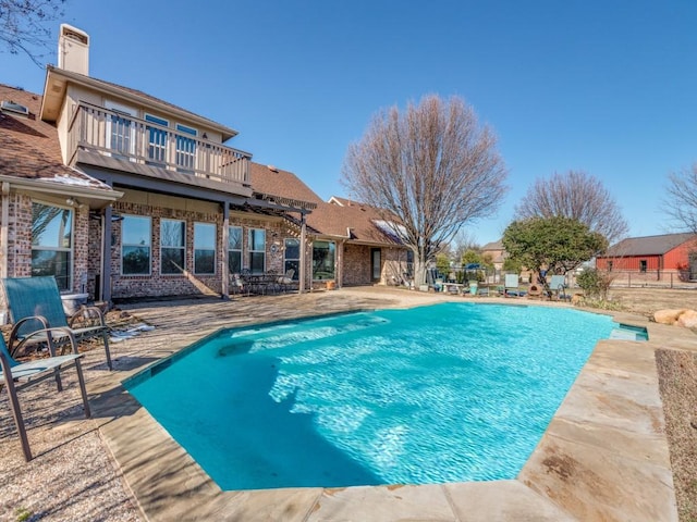 view of swimming pool featuring a patio