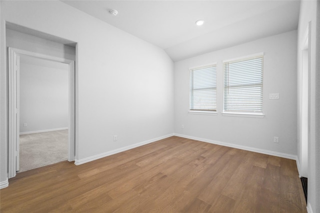 interior space featuring lofted ceiling and light wood-type flooring