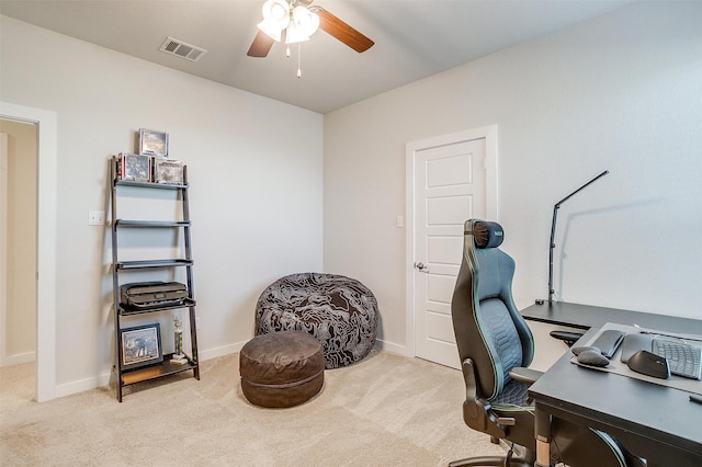 carpeted office with ceiling fan