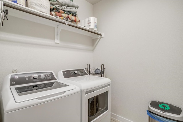 laundry room featuring washing machine and clothes dryer