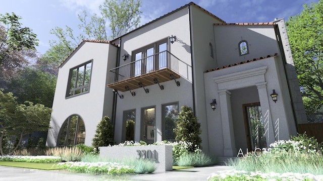 back of property with a balcony