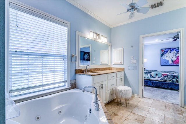 bathroom with tile patterned floors, ornamental molding, vanity, ceiling fan, and a relaxing tiled tub