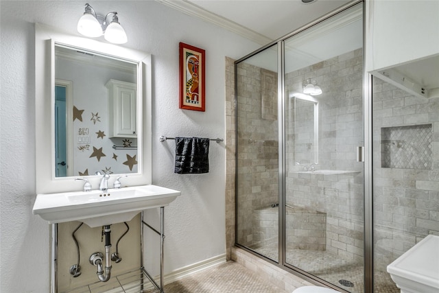 bathroom with a shower with shower door and ornamental molding