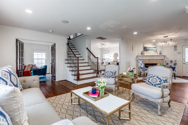 living room with crown molding and wood-type flooring