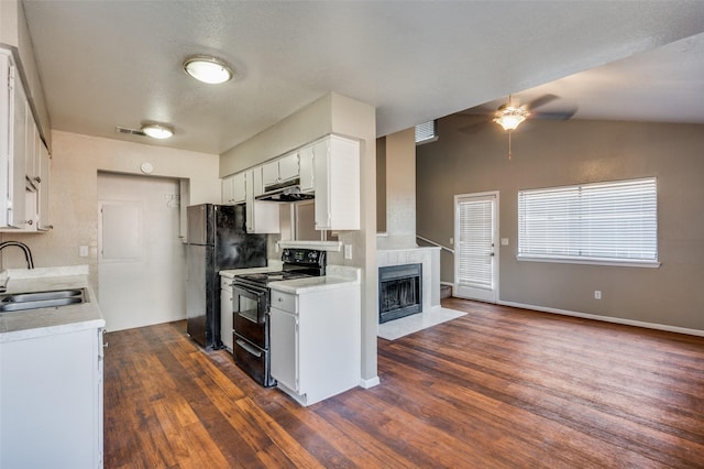 kitchen featuring white cabinetry, sink, black appliances, and dark hardwood / wood-style floors