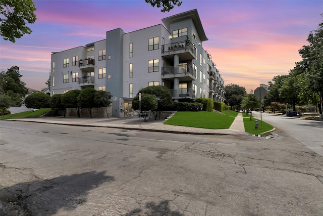 view of outdoor building at dusk