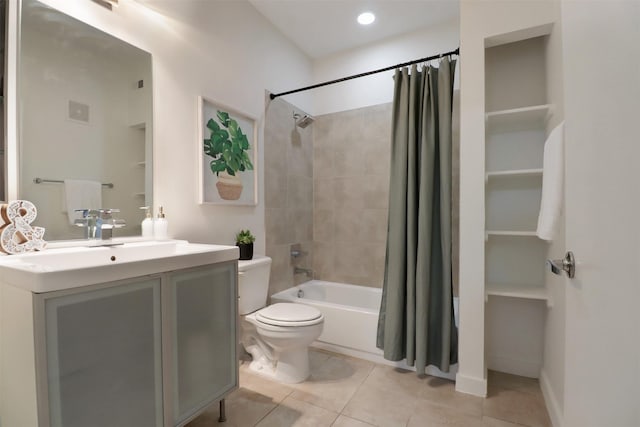 full bathroom with tile patterned flooring, shower / bath combination with curtain, toilet, and vanity