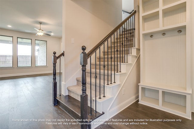 staircase with ceiling fan, wood finished floors, and baseboards