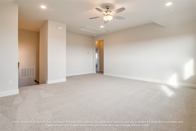 carpeted spare room featuring recessed lighting, visible vents, and baseboards