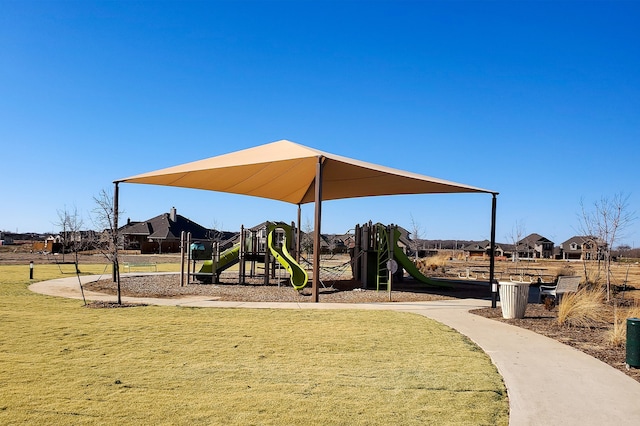 community playground featuring a lawn