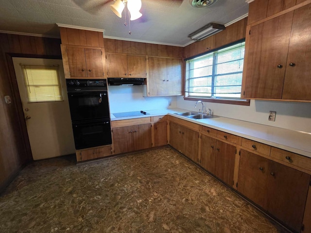 kitchen with crown molding, dobule oven black, electric stovetop, ventilation hood, and light countertops