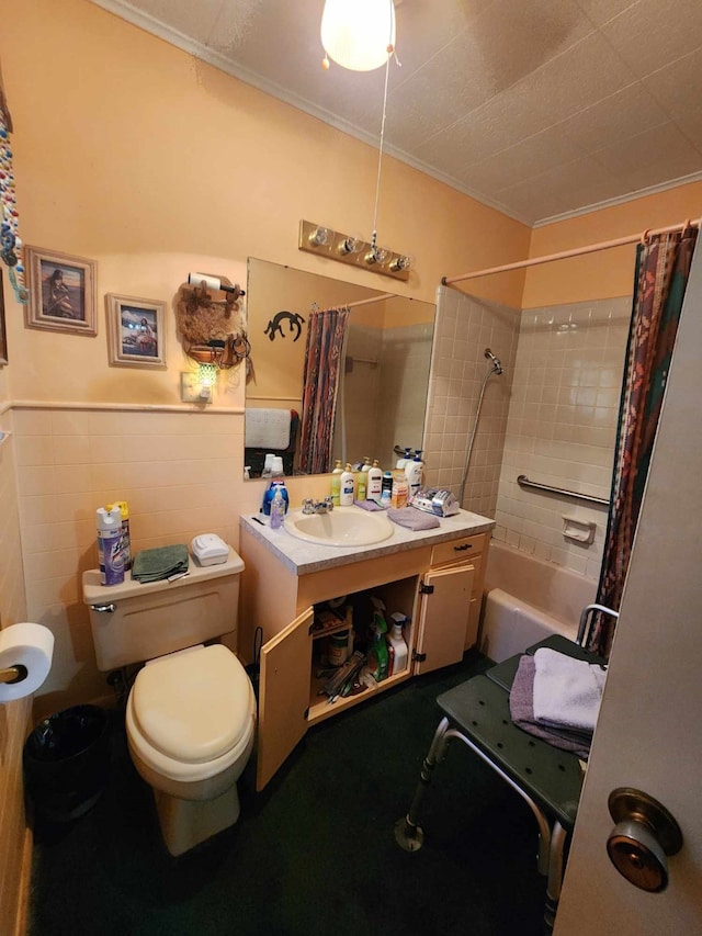 full bathroom featuring vanity, shower / bath combination with curtain, toilet, ornamental molding, and tile walls