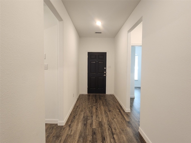 entryway with dark hardwood / wood-style floors