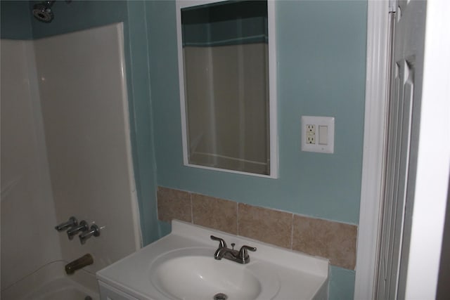 bathroom with vanity and shower / washtub combination