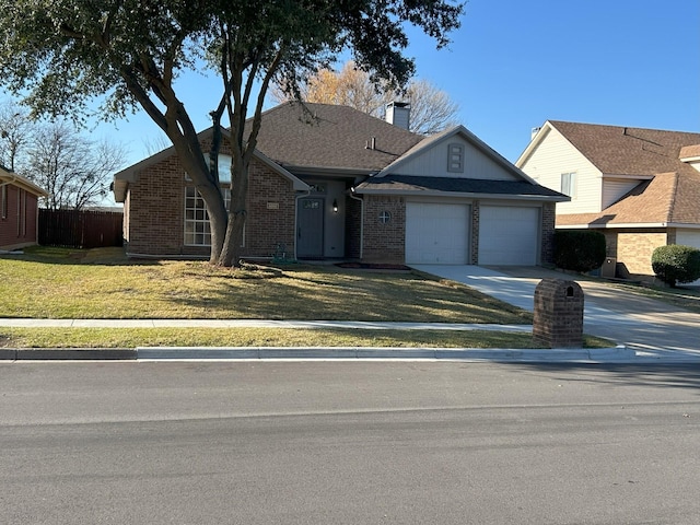 view of front of home with a garage and a front yard