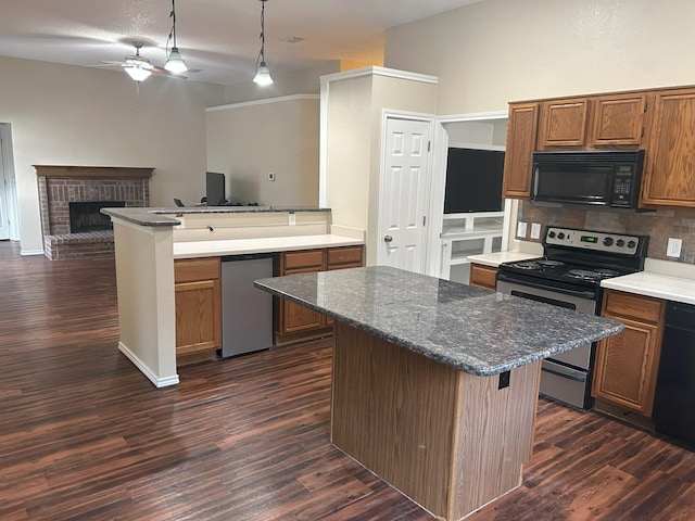 kitchen with ceiling fan, a brick fireplace, decorative light fixtures, decorative backsplash, and black appliances