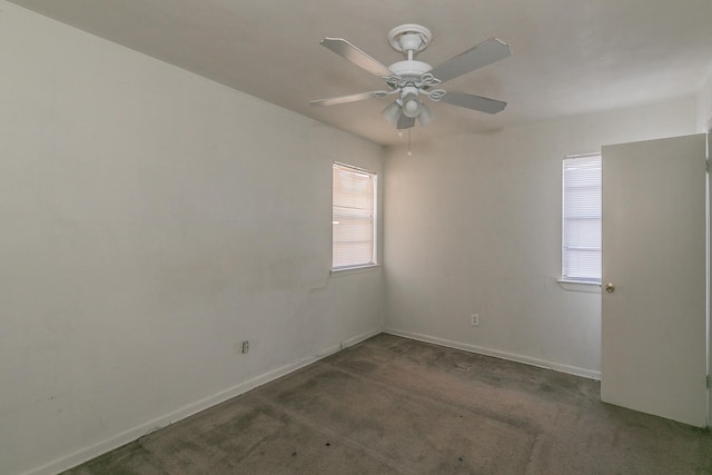 carpeted spare room with ceiling fan