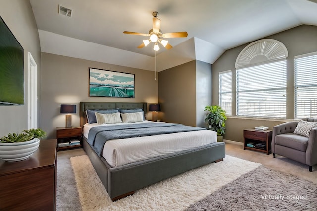 carpeted bedroom featuring vaulted ceiling and ceiling fan