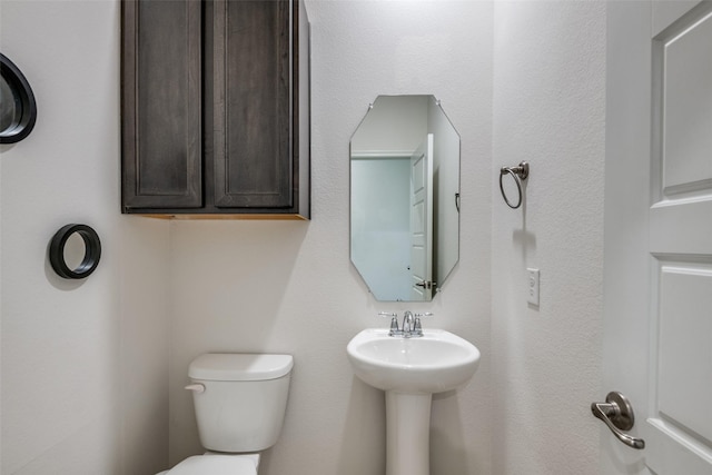 bathroom featuring toilet