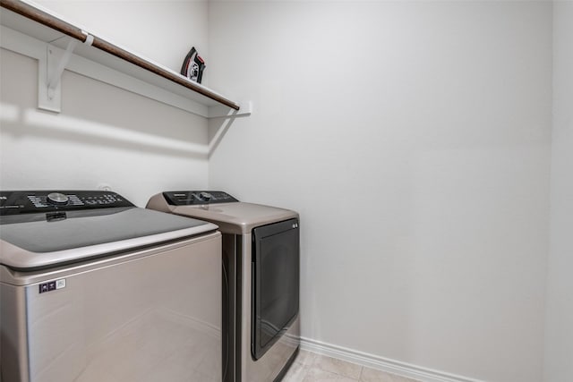 clothes washing area featuring independent washer and dryer