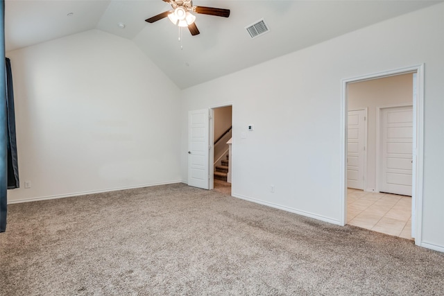 unfurnished bedroom featuring light colored carpet, ceiling fan, and lofted ceiling