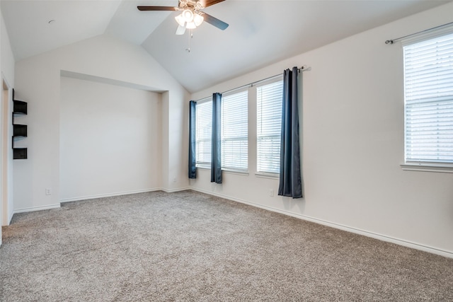 unfurnished room featuring lofted ceiling, ceiling fan, and carpet floors