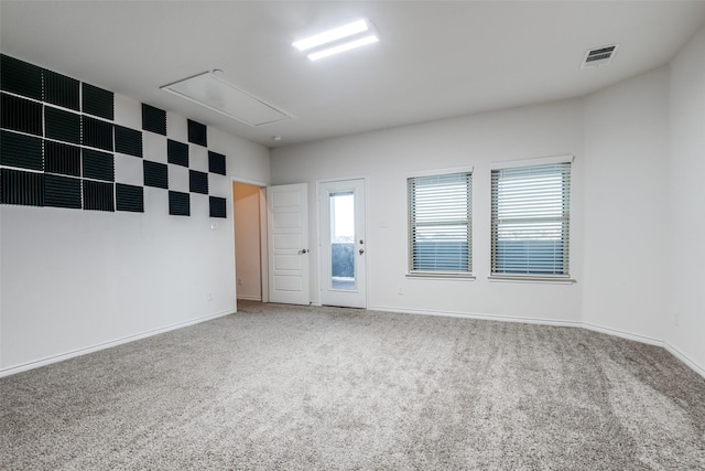 spare room featuring carpet floors and a healthy amount of sunlight