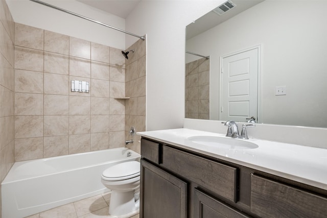 full bathroom with tile patterned floors, vanity, toilet, and tiled shower / bath