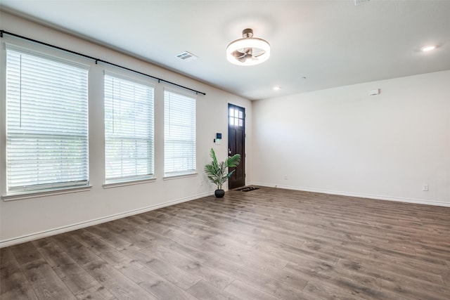 unfurnished room with hardwood / wood-style floors