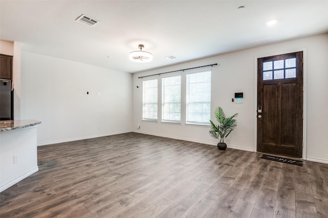 unfurnished living room featuring hardwood / wood-style floors