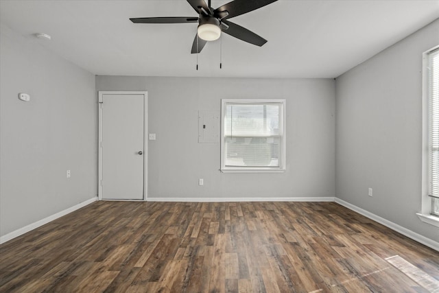 empty room with ceiling fan and dark wood-type flooring