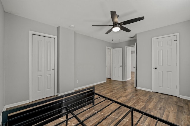 bedroom featuring wood-type flooring and ceiling fan