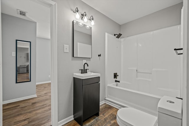 full bathroom featuring vanity, shower / bathing tub combination, wood-type flooring, and toilet