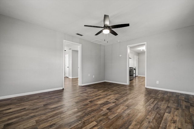 empty room featuring dark hardwood / wood-style flooring and ceiling fan