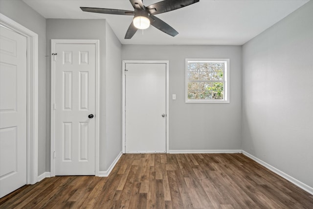 interior space featuring dark hardwood / wood-style floors and ceiling fan