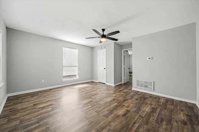 empty room featuring dark hardwood / wood-style floors and ceiling fan