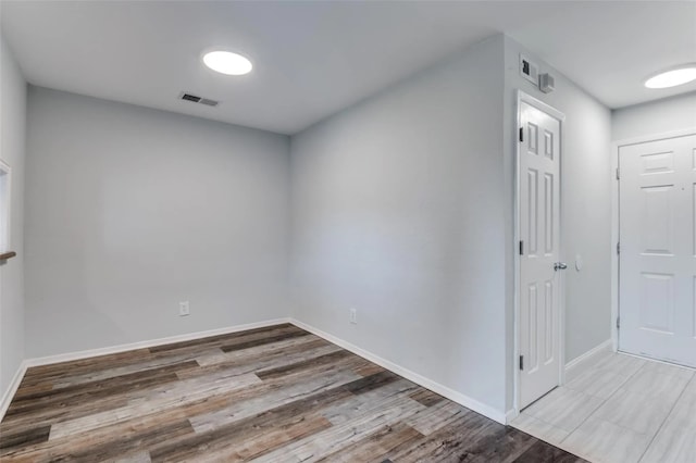 unfurnished room featuring wood-type flooring