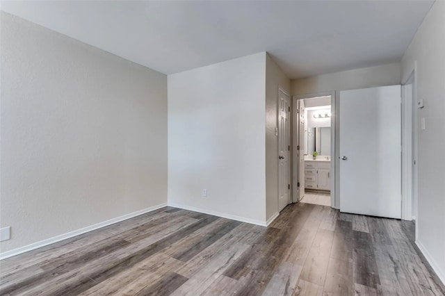 unfurnished room featuring hardwood / wood-style flooring