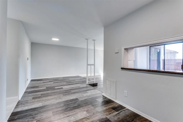 unfurnished room with hardwood / wood-style flooring