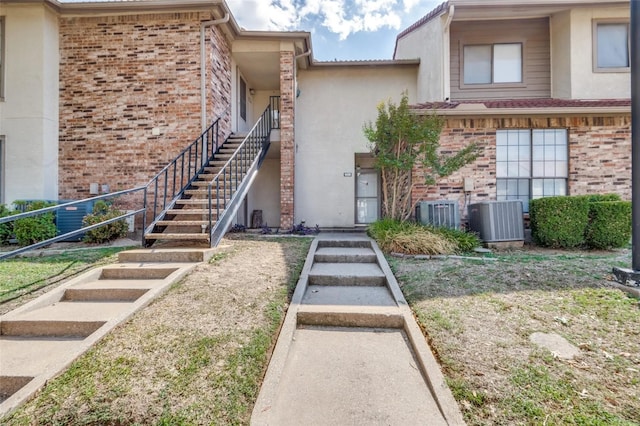 doorway to property with central AC