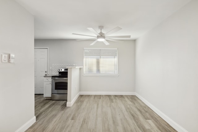 interior space featuring ceiling fan and light hardwood / wood-style flooring