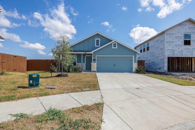 view of front of property featuring a front yard and a garage