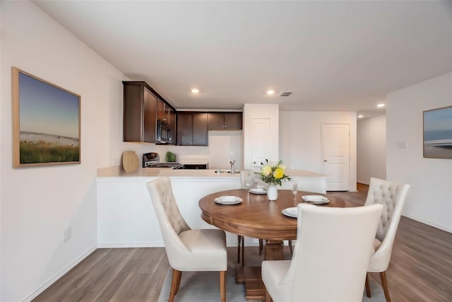 dining space featuring dark hardwood / wood-style floors