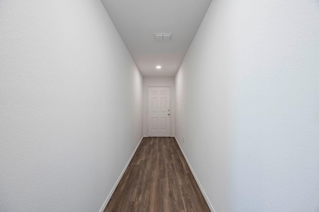 hall with dark hardwood / wood-style floors