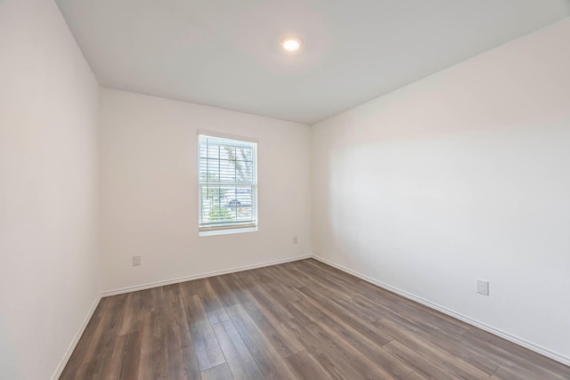 empty room featuring dark hardwood / wood-style floors