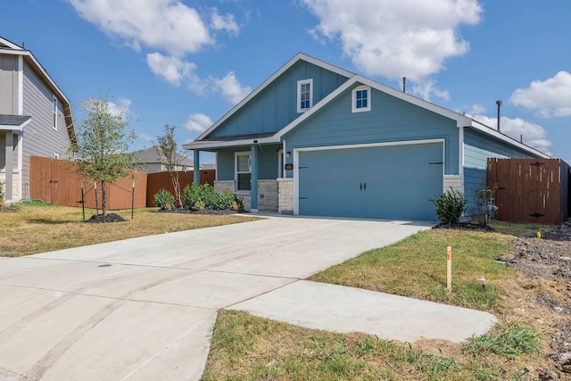 view of front of property featuring a garage and a front lawn