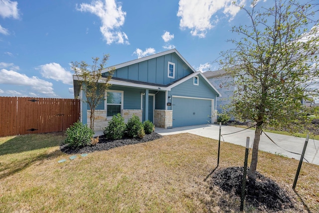 craftsman-style home featuring a garage and a front lawn